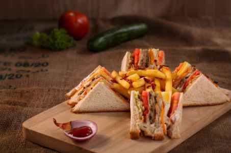 club sandwich served on chopping board